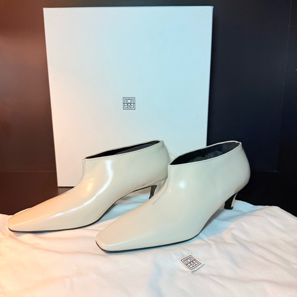 Toteme Cream Patent Leather Ankle Booties